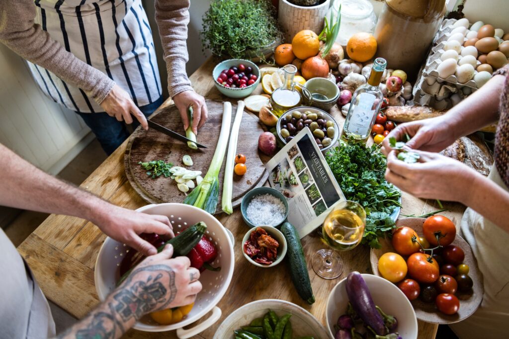 People cooking healthy food in the kitchen